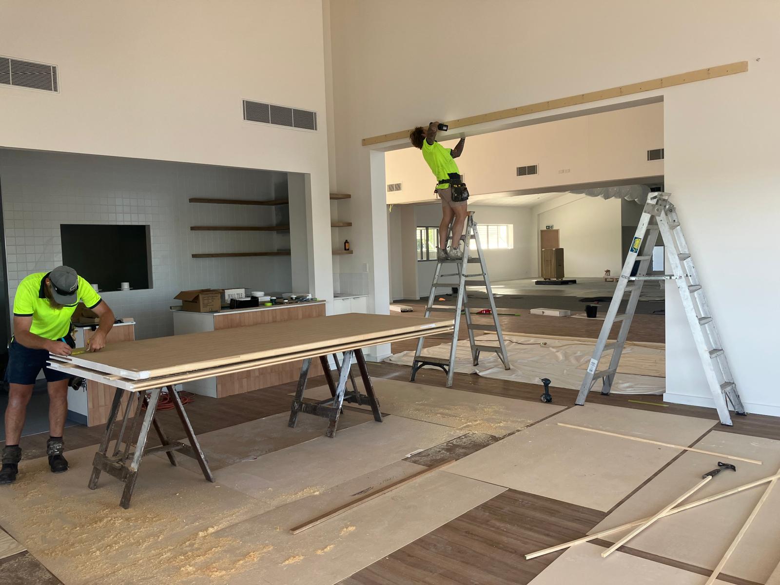 Preparing large wooden panels in the room